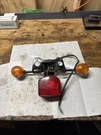Honda CM200T Twinstar Rear Tail Brake Light License Plate Mount Bracket Blinkers. Fixed Price $43.99.